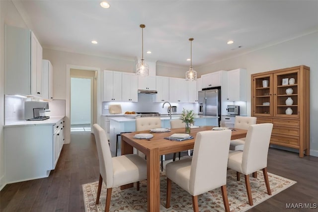 dining area featuring dark wood-type flooring