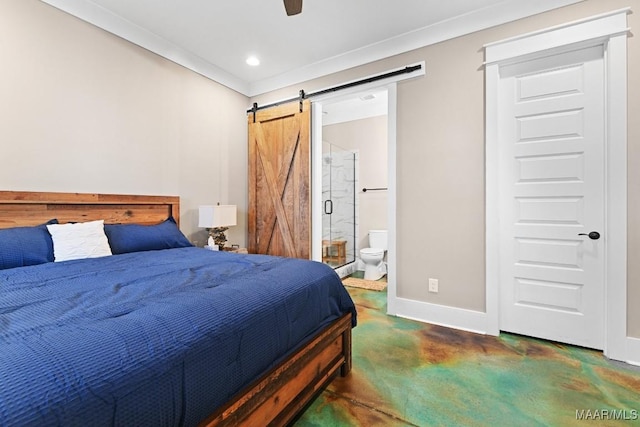 bedroom featuring ceiling fan, connected bathroom, and a barn door