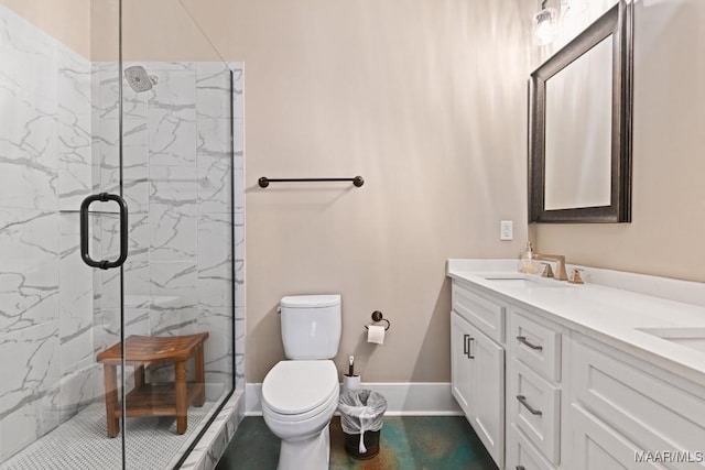 bathroom featuring vanity, toilet, and an enclosed shower