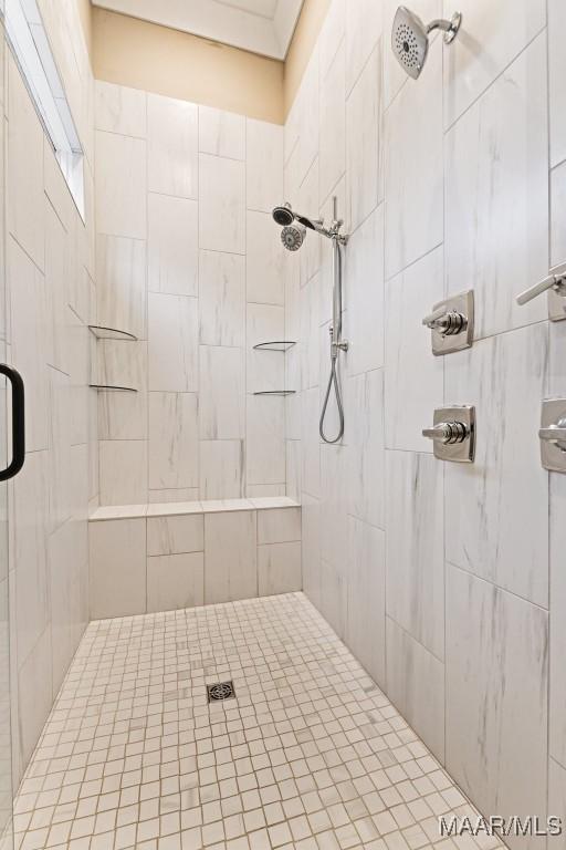 bathroom with tiled shower