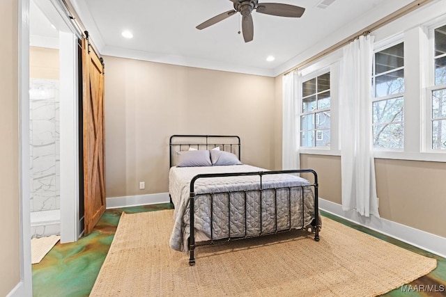 bedroom featuring ceiling fan, ornamental molding, and a barn door