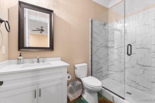 bathroom with vanity, toilet, and an enclosed shower