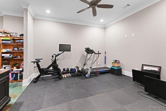 exercise area featuring ornamental molding and ceiling fan