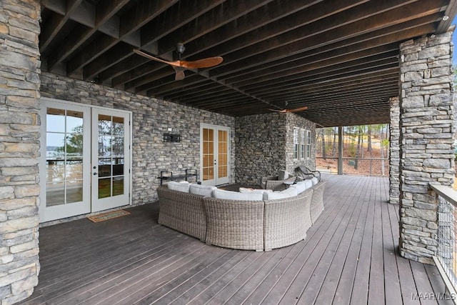 wooden deck with french doors and an outdoor hangout area