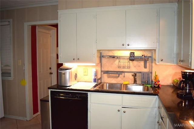 kitchen featuring tasteful backsplash, white cabinets, sink, and dishwasher