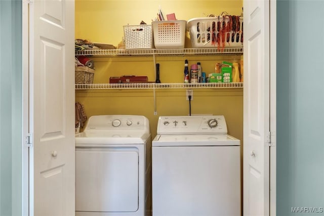 laundry area featuring washing machine and clothes dryer