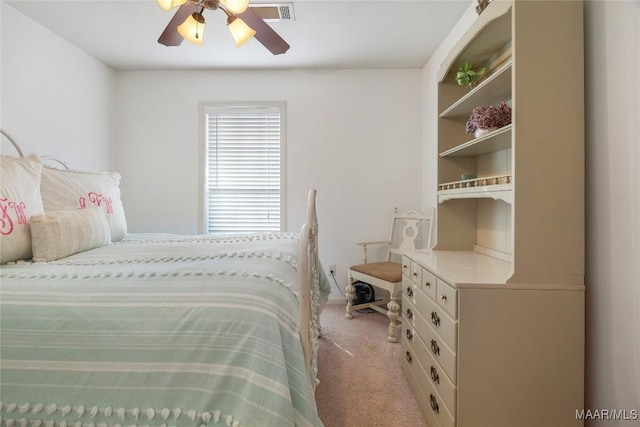 bedroom with light carpet and ceiling fan