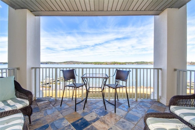 balcony featuring a water view