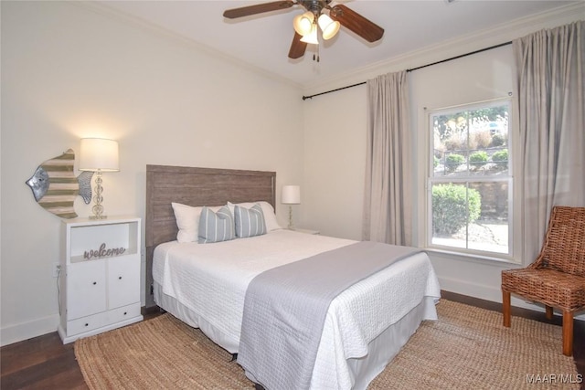 bedroom with crown molding, ceiling fan, and hardwood / wood-style flooring