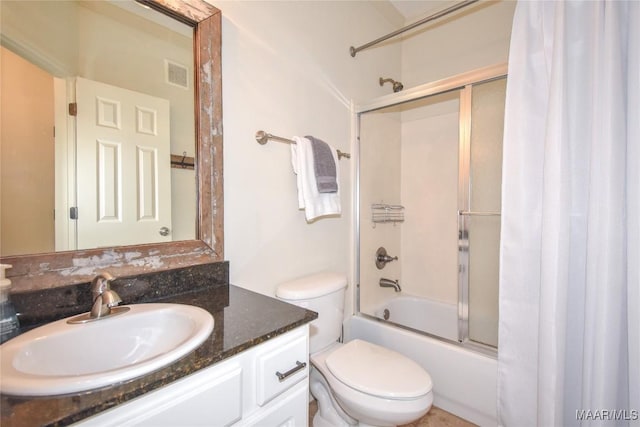 full bathroom with vanity, toilet, and combined bath / shower with glass door