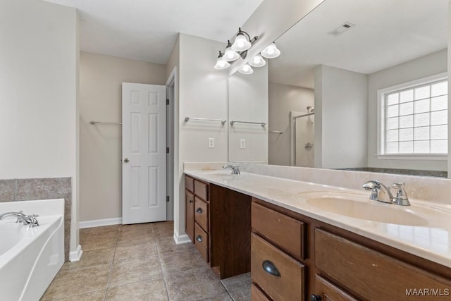 bathroom with independent shower and bath, vanity, and tile patterned floors