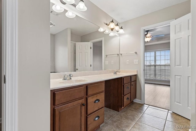 bathroom featuring vanity, tile patterned flooring, and ceiling fan