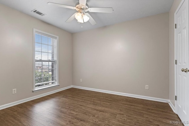 unfurnished bedroom with dark hardwood / wood-style flooring and ceiling fan