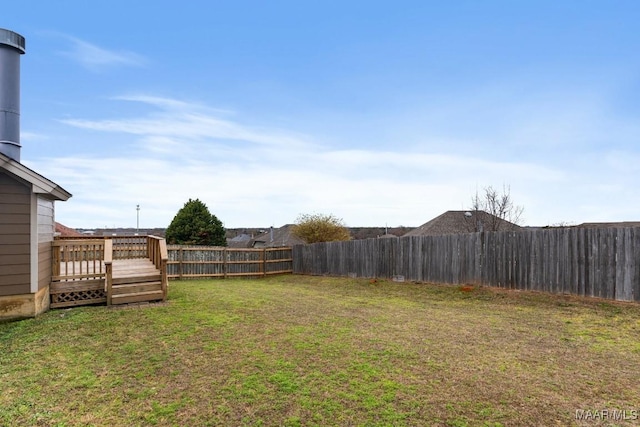 view of yard with a wooden deck