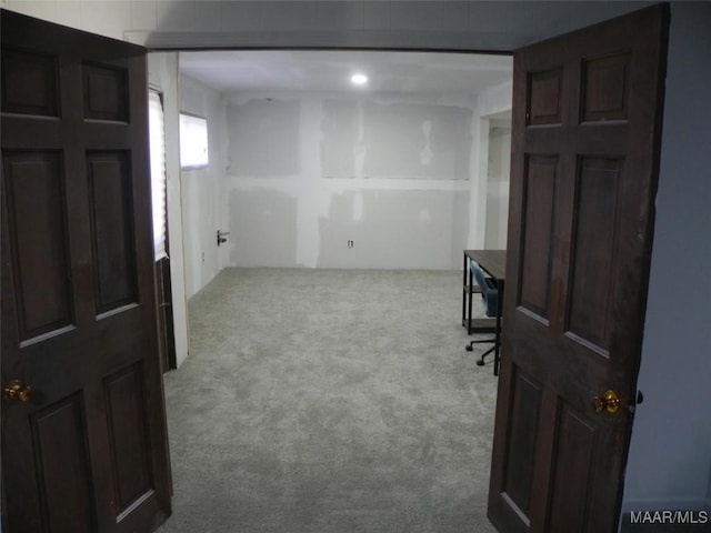 view of carpeted foyer entrance