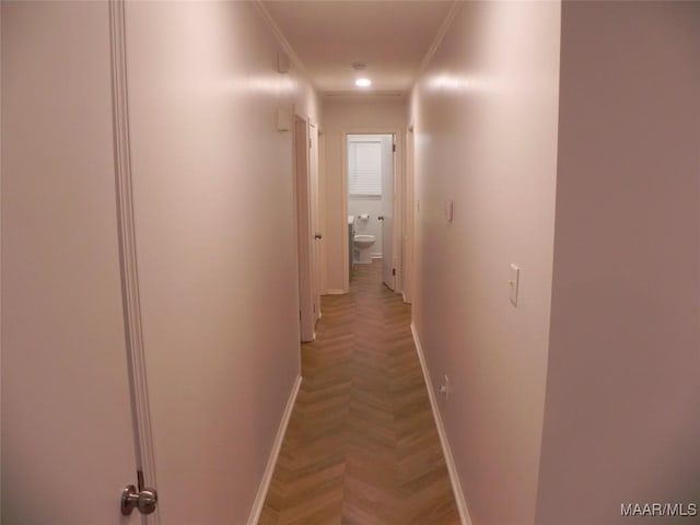 hall with parquet flooring and ornamental molding