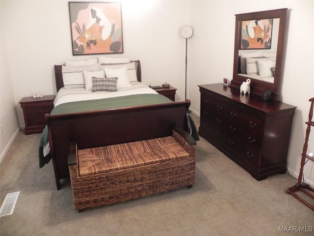 bedroom with light colored carpet