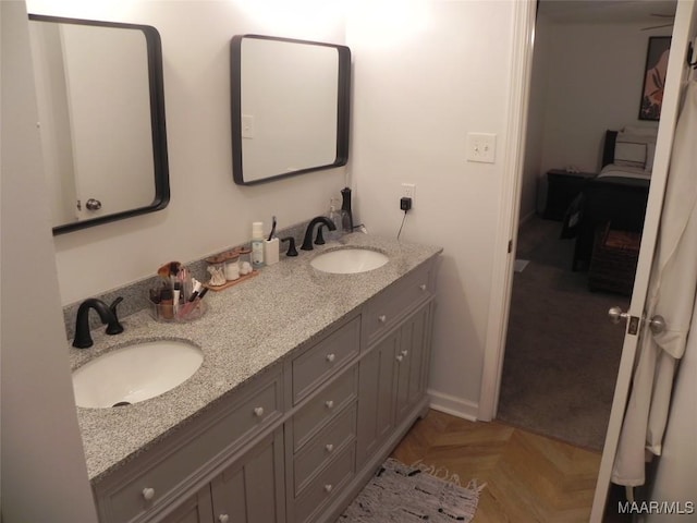 bathroom featuring vanity and parquet floors