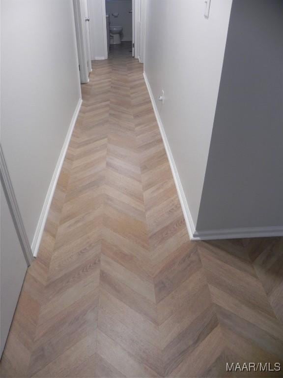 hallway with light parquet floors