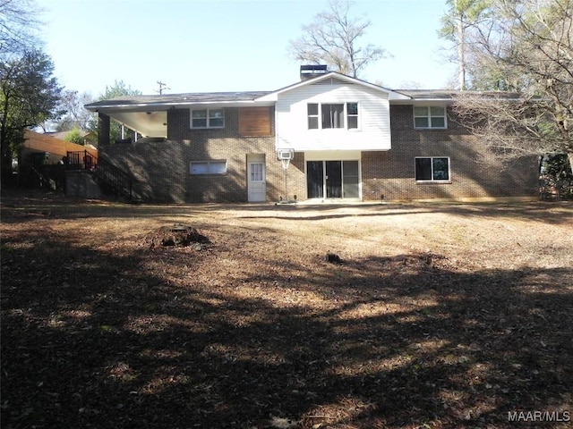 rear view of property featuring a wall mounted air conditioner