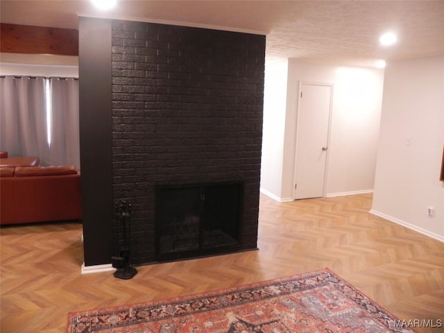 unfurnished living room featuring light parquet flooring and a brick fireplace