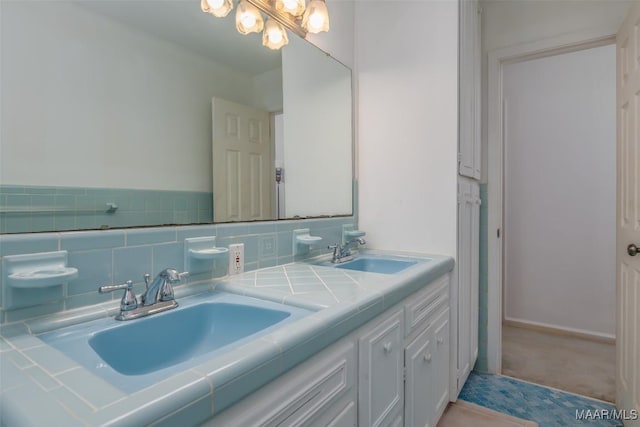 bathroom with vanity and backsplash