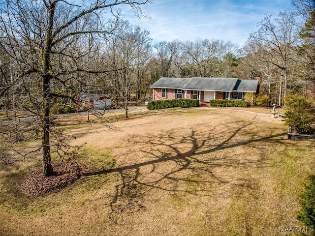 view of front facade with a front yard and covered porch