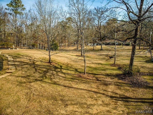 exterior space with a yard and a rural view