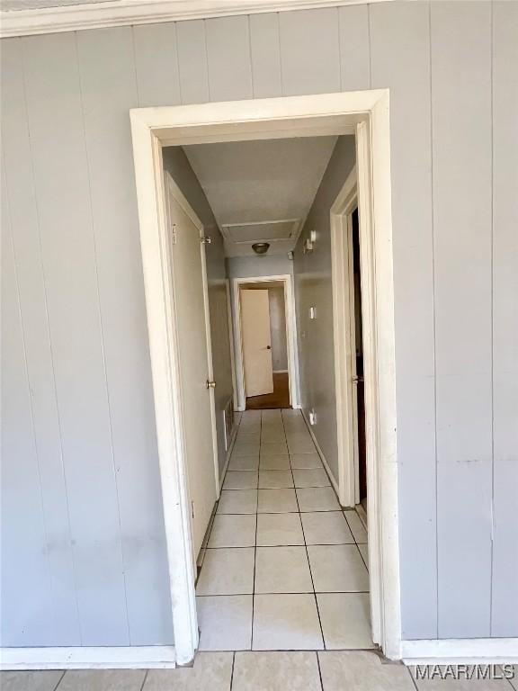 corridor with light tile patterned flooring