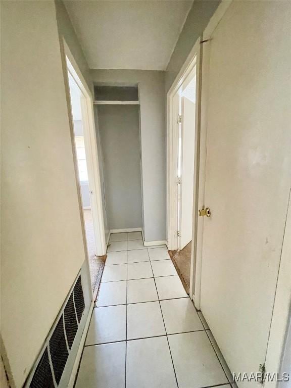 hallway featuring light tile patterned flooring