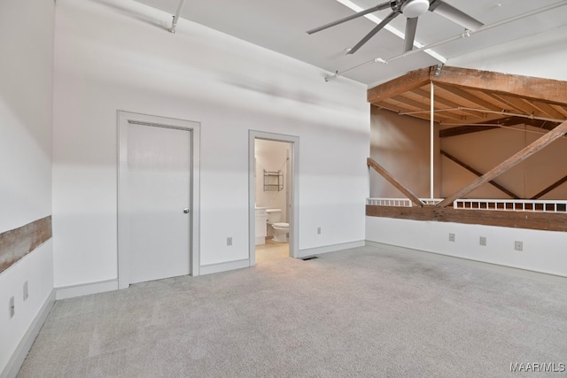 spare room featuring carpet floors and ceiling fan