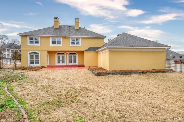 back of house featuring french doors