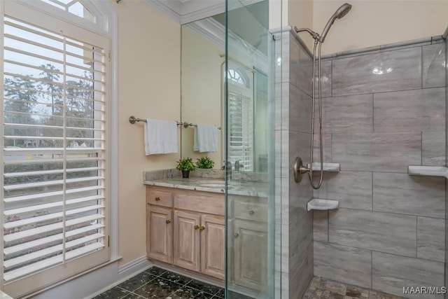 bathroom featuring vanity and a shower with door