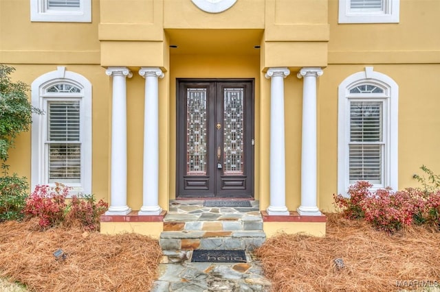 property entrance featuring french doors