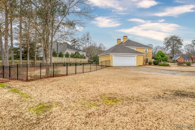 view of yard featuring a garage