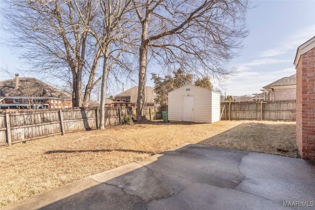 view of yard with a patio area and a shed