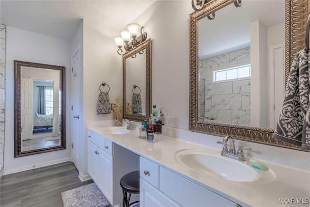 bathroom featuring hardwood / wood-style flooring and vanity