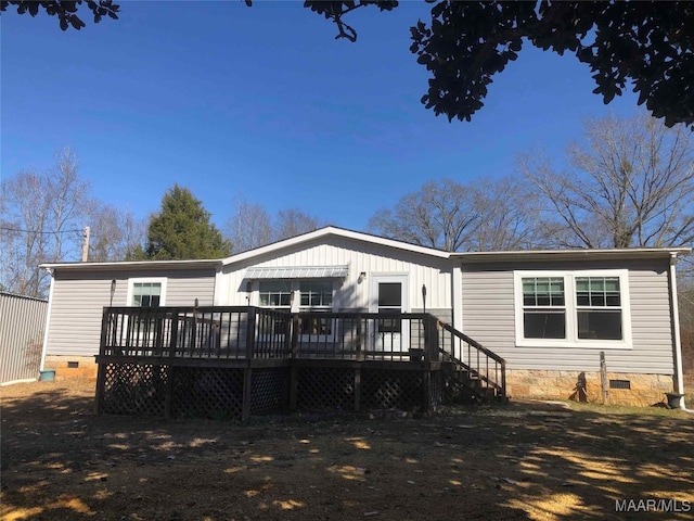 rear view of house featuring a deck