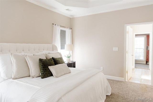 bedroom featuring baseboards, carpet floors, visible vents, and crown molding