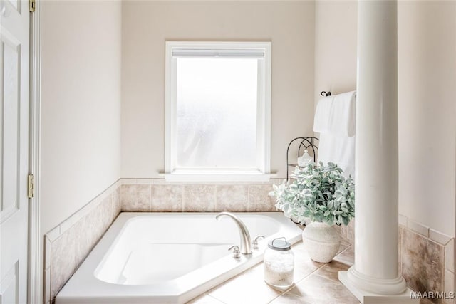 full bath with a garden tub and ornate columns