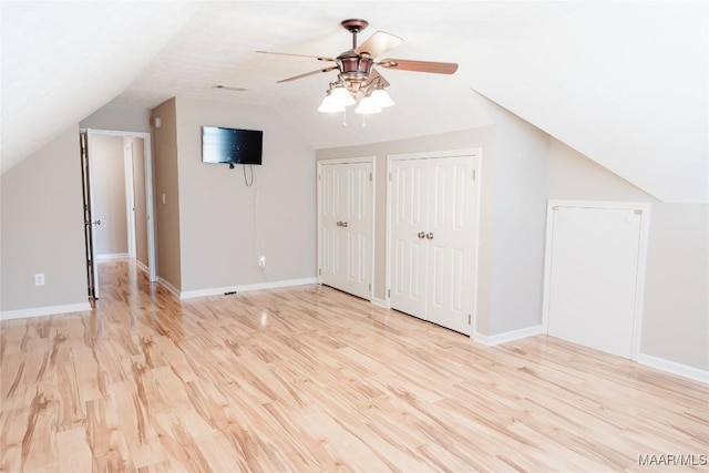 bonus room with vaulted ceiling, ceiling fan, and light hardwood / wood-style floors