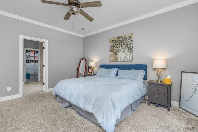 carpeted bedroom with baseboards, a ceiling fan, visible vents, and crown molding