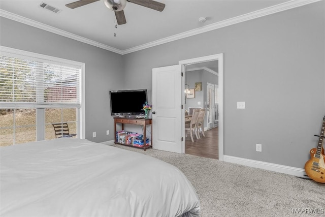 bedroom featuring carpet, visible vents, baseboards, and ornamental molding