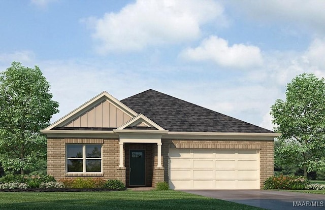 view of front of property with a garage and a front yard