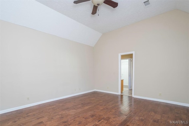 unfurnished room with lofted ceiling, hardwood / wood-style flooring, a textured ceiling, and ceiling fan