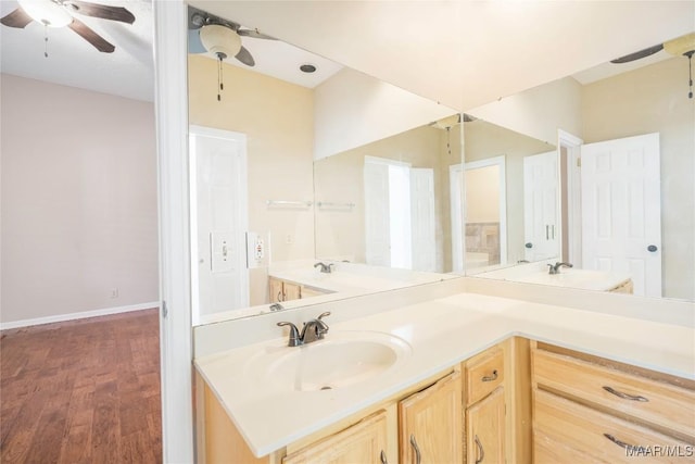 bathroom featuring vanity, wood-type flooring, and ceiling fan