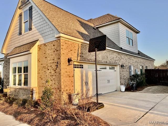 view of side of property with a garage