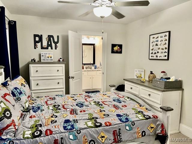 bedroom with carpet floors, ceiling fan, and ensuite bathroom