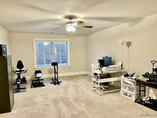 carpeted office with ceiling fan