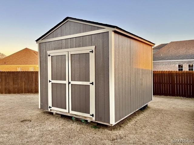 view of outdoor structure at dusk